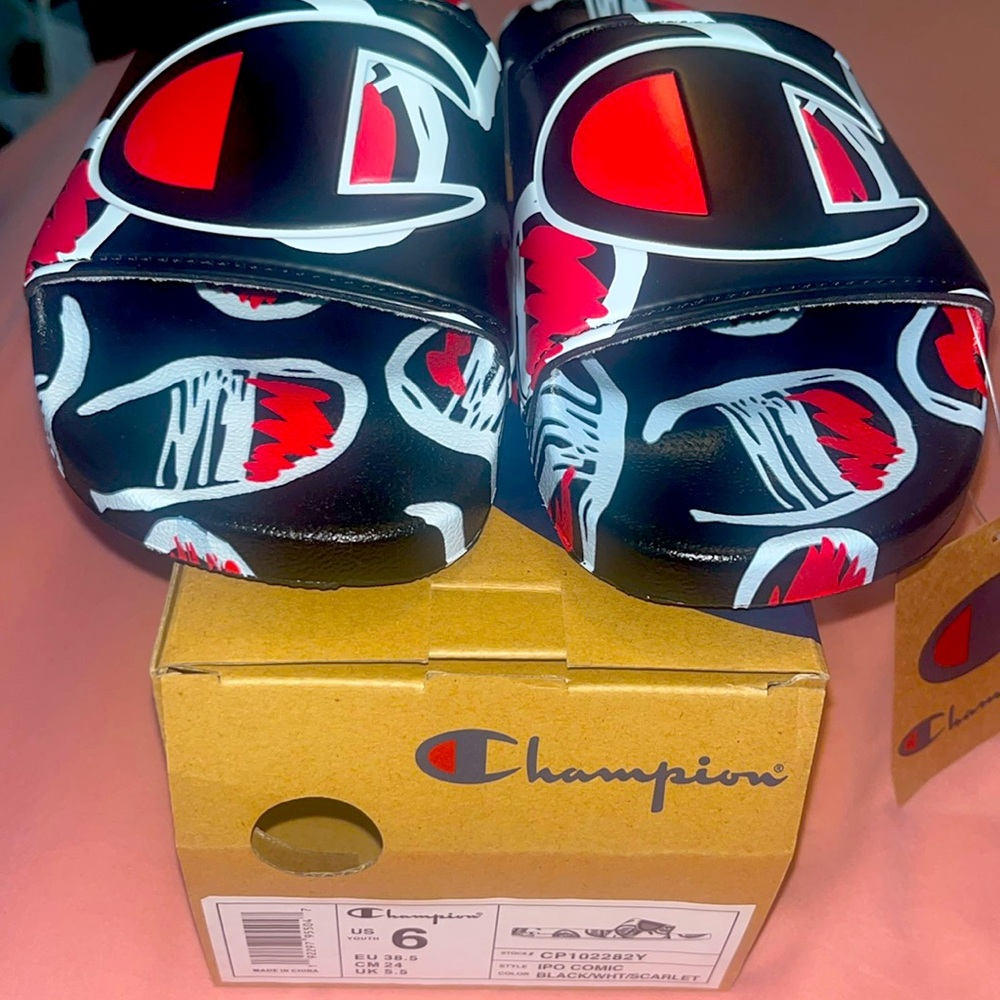 Brand new! Kids size 6 champion slides!